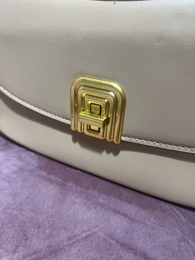 Beige Shoulder Bag with Gold Hardware (Category: Shoulder Bags) located in Manila. Submitted by malggg (Listing ID 1470881939, Image 2). Description: (Making space for new things!) Gifted to me but I haven’t had the chance to use it yet, so I might just well sell :) Brand new (but without a tag anymore!) and stored well. 1 main compartment, 1 pocket, and 3 card slots. MOD: Grab/Lalamove same-day delivery (within Metro Manila), J&T (outside Metro 