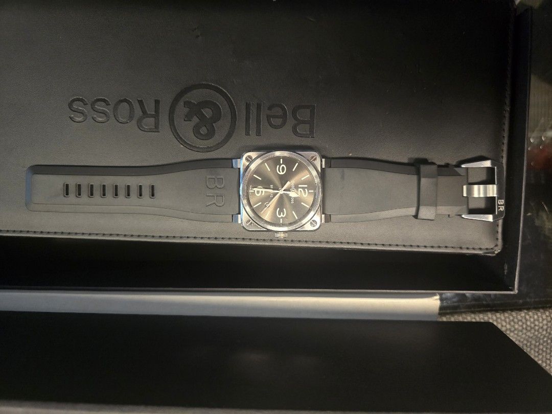Bell & Ross BR03-92 (Category: Luxury Watches) located in Caloocan City. Submitted by binger705193752 (Listing ID 1470745020, Image 2). Description: Stainless Steel Golden Heritage Automatic 42mm Bezel Color Silver Case Color Silver Strap Rubber Black included military strap navy blue with original box and manual.