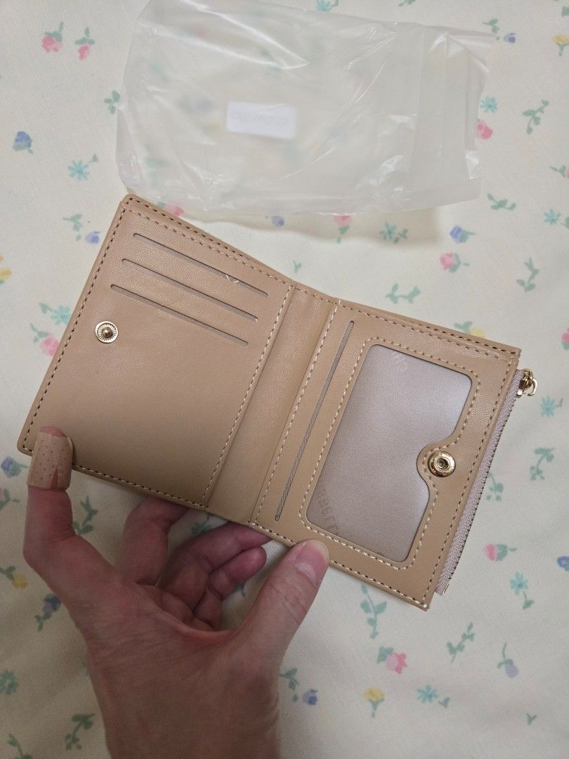 Bifold wallet with zip coin purse (Category: Wallets & Card holders) located in Manila. Submitted by chocomoose (Listing ID 1470825363, Image 3). Description: off white small bifold wallet for women with zippered area for coins with card slots.
