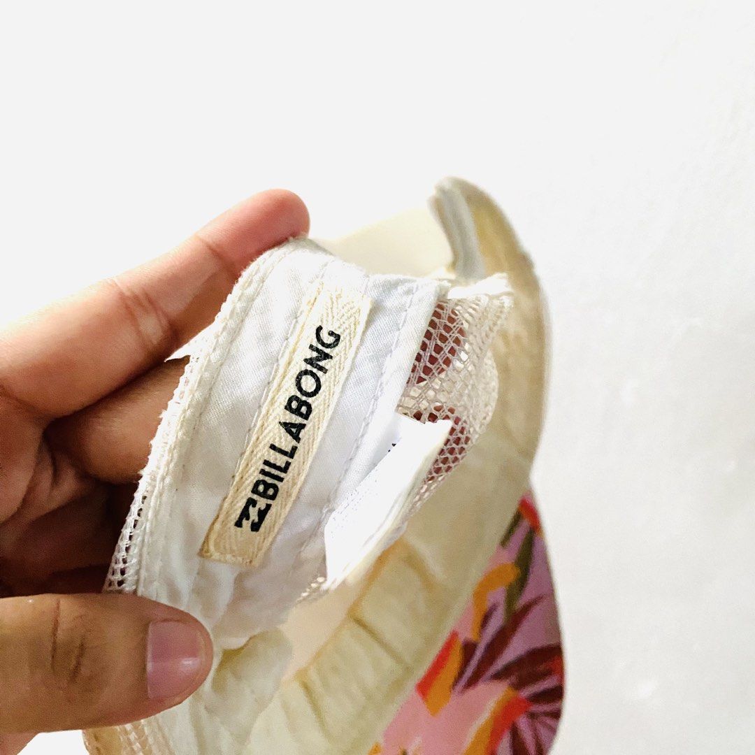 Billabong Floral Trucker Hat (Category: Caps & Hats) located in Caloocan City. Submitted by lovemyclothes21 (Listing ID 1470919767, Image 2). Description: - Brand: Billabong - Design: Colorful tropical floral print on front and brim - Comfort: Breathable white mesh back panels - Fit: Adjustable snapback closure with curved visor - Details: Features signature Billabong woven label and interior branding - Condition: Great fun summer accessory ready