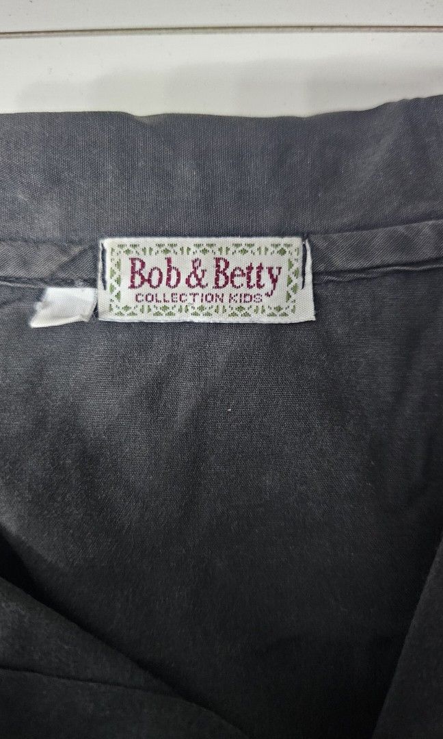 Black Button Down Top (Category: Blouses) located in Manila. Submitted by dndgnzlz (Listing ID 1470835537, Image 2). Description: Brand: Bob & Betty Size: Small Faded Color Payment first policy MOP: BPI, Gcash, Maya Courier: LBC, J&T, Lalamove, Grab.