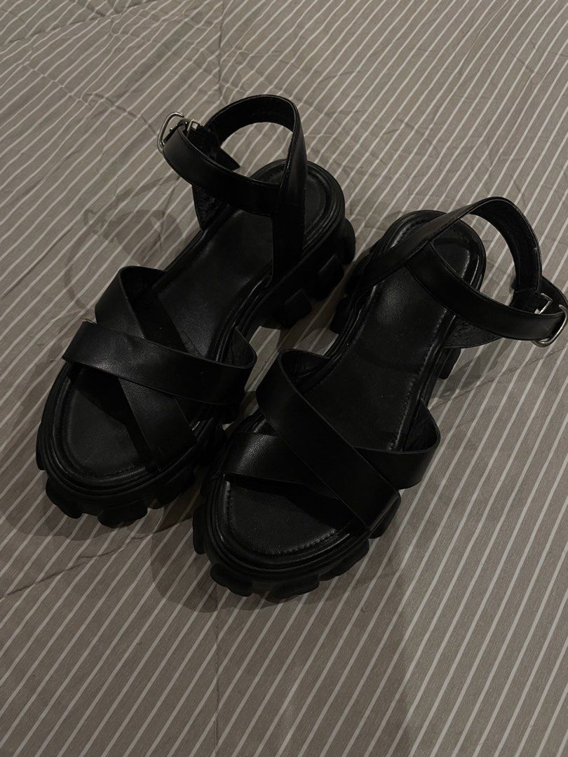 Black Chunky Lug Sole Platform Sandals Ankle Strap (Category: Heels) located in Manila. Submitted by franceshous (Listing ID 1470752663, Image 1). Description: - Color: Black - Style: Platform sandals with chunky lug soles - Details: Crisscross toe straps and ankle strap with metal buckle closure - Condition: Good overall, with minor signs of handling - Best for: Comfortable everyday wear.