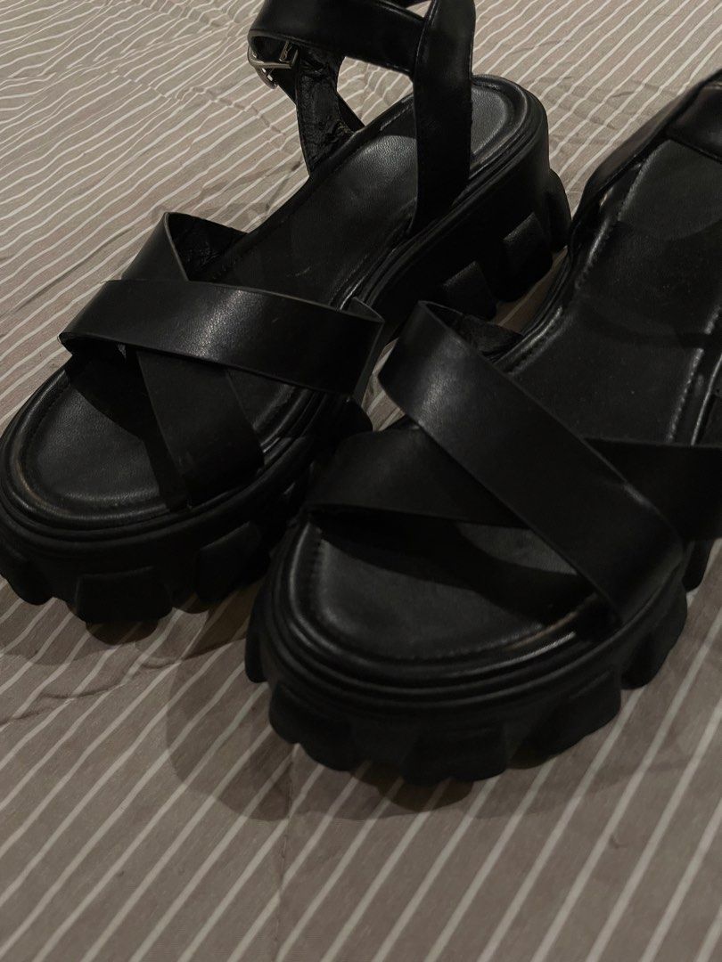 Black Chunky Lug Sole Platform Sandals Ankle Strap (Category: Heels) located in Manila. Submitted by franceshous (Listing ID 1470752663, Image 2). Description: - Color: Black - Style: Platform sandals with chunky lug soles - Details: Crisscross toe straps and ankle strap with metal buckle closure - Condition: Good overall, with minor signs of handling - Best for: Comfortable everyday wear.