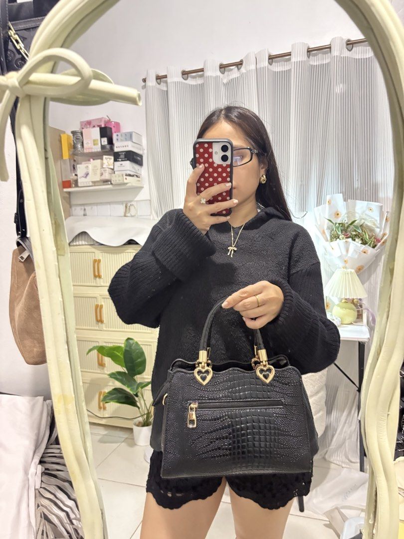 Black Croc Pattern Handbag with Gold Heart Accents (Category: Shoulder Bags) located in Santo Tomas. Submitted by skyy14 (Listing ID 1470864251, Image 3). Description: - Color & Texture: Elegant black with an all-over glossy crocodile finish - Hardware: Shiny gold-tone with cute heart-shaped handle attachments - Versatility: Includes top handles and a detachable shoulder strap - Storage: Clean interior for daily essentials plus a handy back zippe