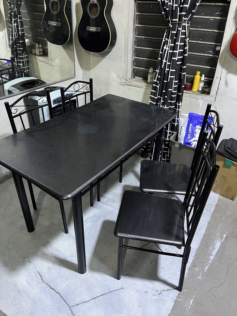 Black Dining Table with Four Matching Chairs (Category: Tables & Sets) located in Manila. Submitted by jettypatootie_12345 (Listing ID 1470845212, Image 2). Description: - Complete dining set: 1 black textured table and 4 matching metal chairs - Space-saving design: Chairs tuck neatly underneath the table - Durable build: Sturdy solid metal frames throughout - Stylish finish: Sleek speckled surface finish - Perfect size: Ideal for small dining sp