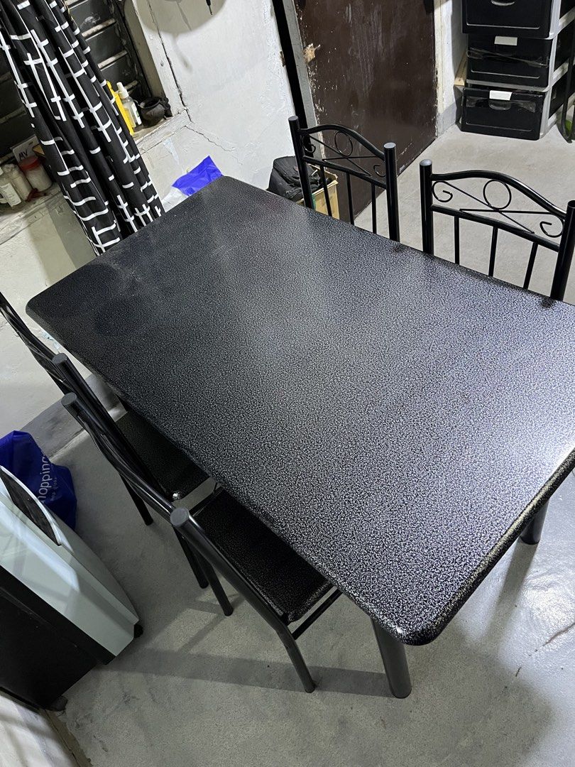 Black Dining Table with Four Matching Chairs (Category: Tables & Sets) located in Manila. Submitted by jettypatootie_12345 (Listing ID 1470845212, Image 3). Description: - Complete dining set: 1 black textured table and 4 matching metal chairs - Space-saving design: Chairs tuck neatly underneath the table - Durable build: Sturdy solid metal frames throughout - Stylish finish: Sleek speckled surface finish - Perfect size: Ideal for small dining sp