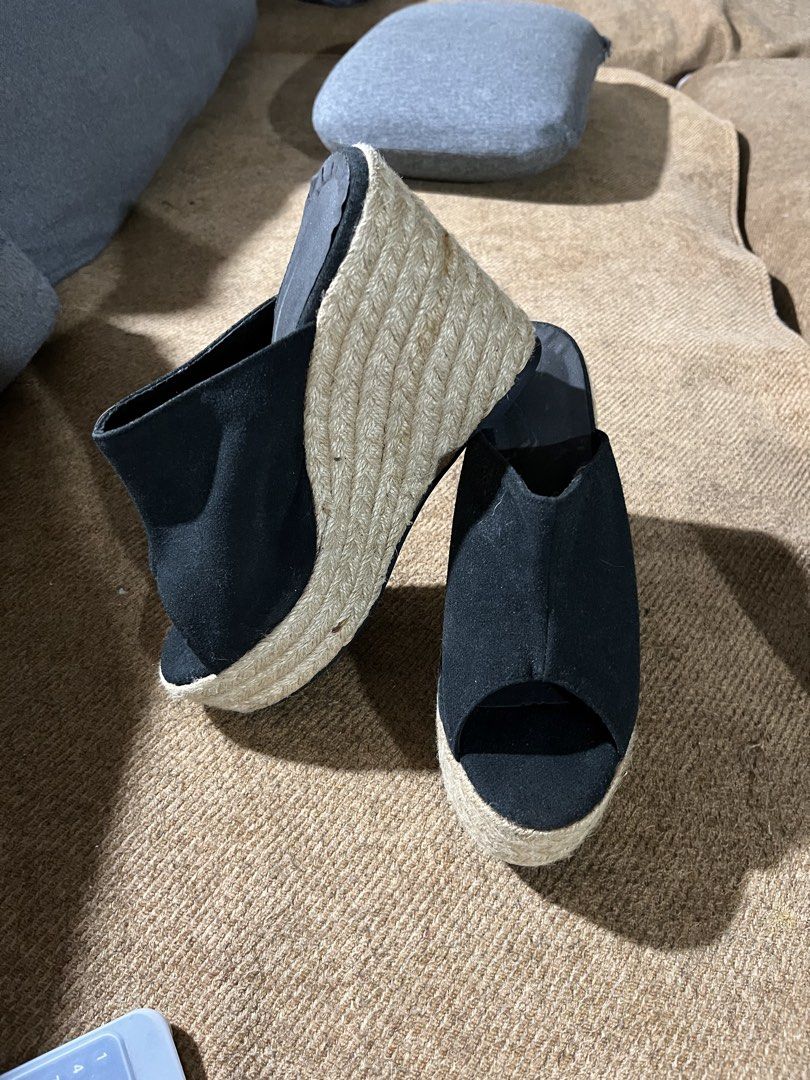 Black Espadrille Wedge Platform Mules Size 39 (Category: Wedges) located in Manila. Submitted by madfitzz (Listing ID 1470901416, Image 3). Description: - Style: Slip-on mule wedge sandals - Color: Black fabric upper - Heel: Woven jute platform wedge with rubber heel tap - Toe: Open toe - Size: EU 39 (stamped on sole) - Condition: Pre-loved with minimal wear and light scuffing on soles - Origin: Made in China.