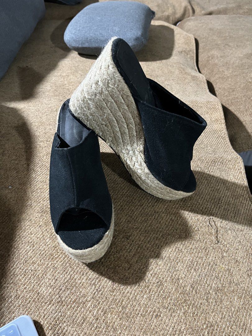 Black Espadrille Wedge Platform Mules Size 39 (Category: Wedges) located in Manila. Submitted by madfitzz (Listing ID 1470901416, Image 2). Description: - Style: Slip-on mule wedge sandals - Color: Black fabric upper - Heel: Woven jute platform wedge with rubber heel tap - Toe: Open toe - Size: EU 39 (stamped on sole) - Condition: Pre-loved with minimal wear and light scuffing on soles - Origin: Made in China.
