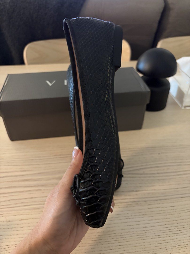 Black Flats ( Vita Linya) (Category: Flats & Sandals) located in Quezon City. Submitted by absam26 (Listing ID 1470788726, Image 2). Description: - Color: Black with all-over snake print texture - Design: Square toe with a cute front bow detail - Size: 37 / 235 marked on the sole - Comfort: Light pink inner sole lining - Sole: Brown textured outer sole with low stacked heel - Inclusion: Original box included.
