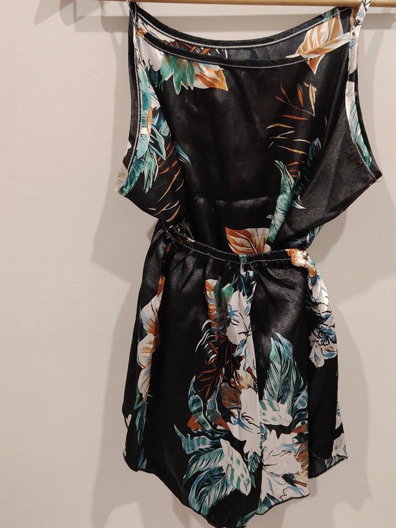 Black Floral Tropical Print Spaghetti Strap Romper (Category: Rompers) located in Manila. Submitted by jacelllamb12233 (Listing ID 1470863690, Image 2). Description: - Style: Black romper with vibrant tropical leaf and floral print - Fit: Scoop neckline, thin spaghetti straps, and cinched elastic waist - Material: Lightweight, silky, and super flowy fabric - Comfort: Perfect for warm weather and easy to slip on - Condition: Brand new / Excellent 
