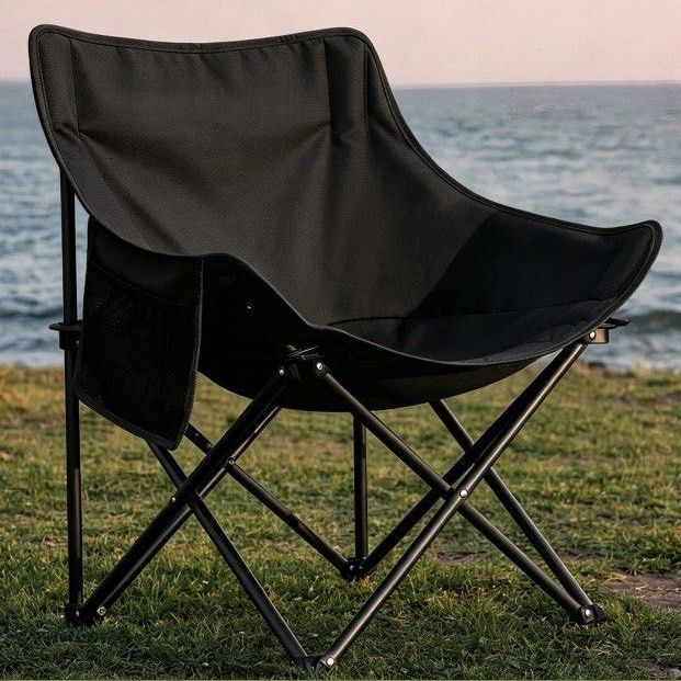 Black foldable outdoor camping chair with side pocket (Category: Hiking & Camping) located in Bocaue. Submitted by pat.staines (Listing ID 1470832471, Image 1). Description: brandnew.