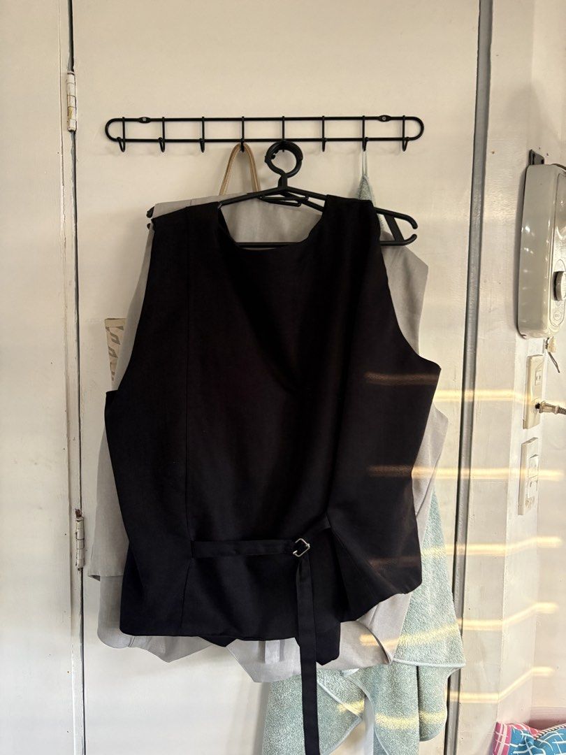 black vest top cozy komfi 2xl (Category: Vests) located in Pasig City. Submitted by meowdei (Listing ID 1470747404, Image 3). Description: - Color: Classic Black - Fit: Tailored with a shaped hem for a sharp look - Closure: V-neck front with three black buttons - Adjustability: Matching back strap with a silver buckle - mop: gcash, bpi, maribank, metrobank - mod: lalamove, grab, jnt - can do meet up as long as within/around ortigas! :).