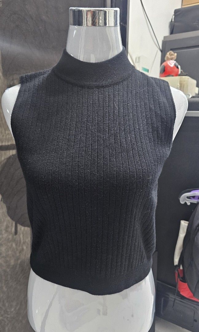 Black Knitted High-Neck Sleeveless (Category: Sleeveless) located in Manila. Submitted by dndgnzlz (Listing ID 1470874887, Image 1). Description: Brand: N/A Size: small, best fit up to medium Fitted, stretchy fabric Never been used Payment first policy MOP: BPI, Gcash, Maya Courier: LBC, J&T, Lalamove, Grab.
