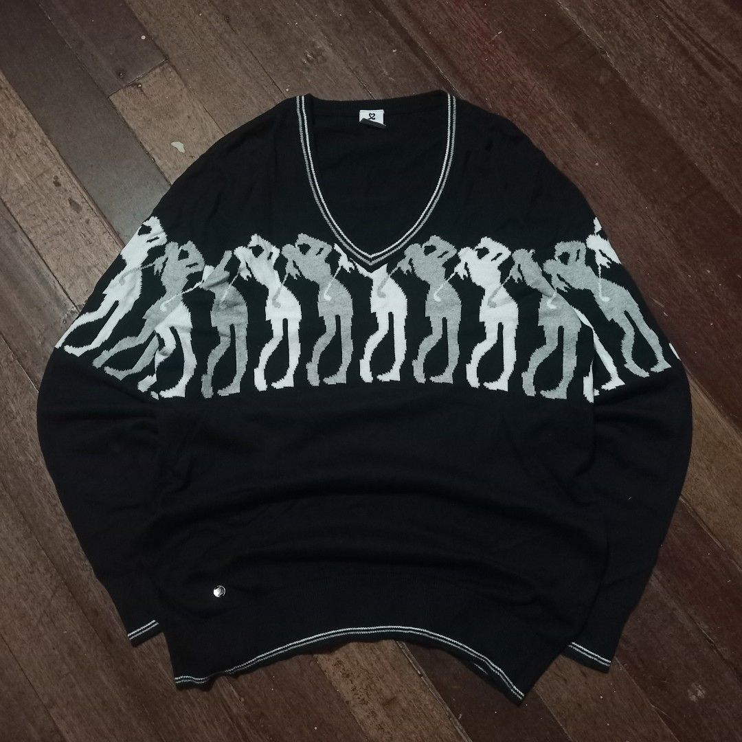 Black knitted sweater V shaped (Category: Coats, Jackets and Outerwear) located in Cavite. Submitted by kurtgg.what (Listing ID 1470799145, Image 1). Description: - Brand: Daily Sports - Item: Golf sweater - Color: Black with contrast tipping on V-neck - Design: Repeating golfer silhouettes graphic across chest and sleeves - Details: Ribbed cuffs and hem - Size: XXL - Condition: Excellent pre-loved condition (ready to wear).