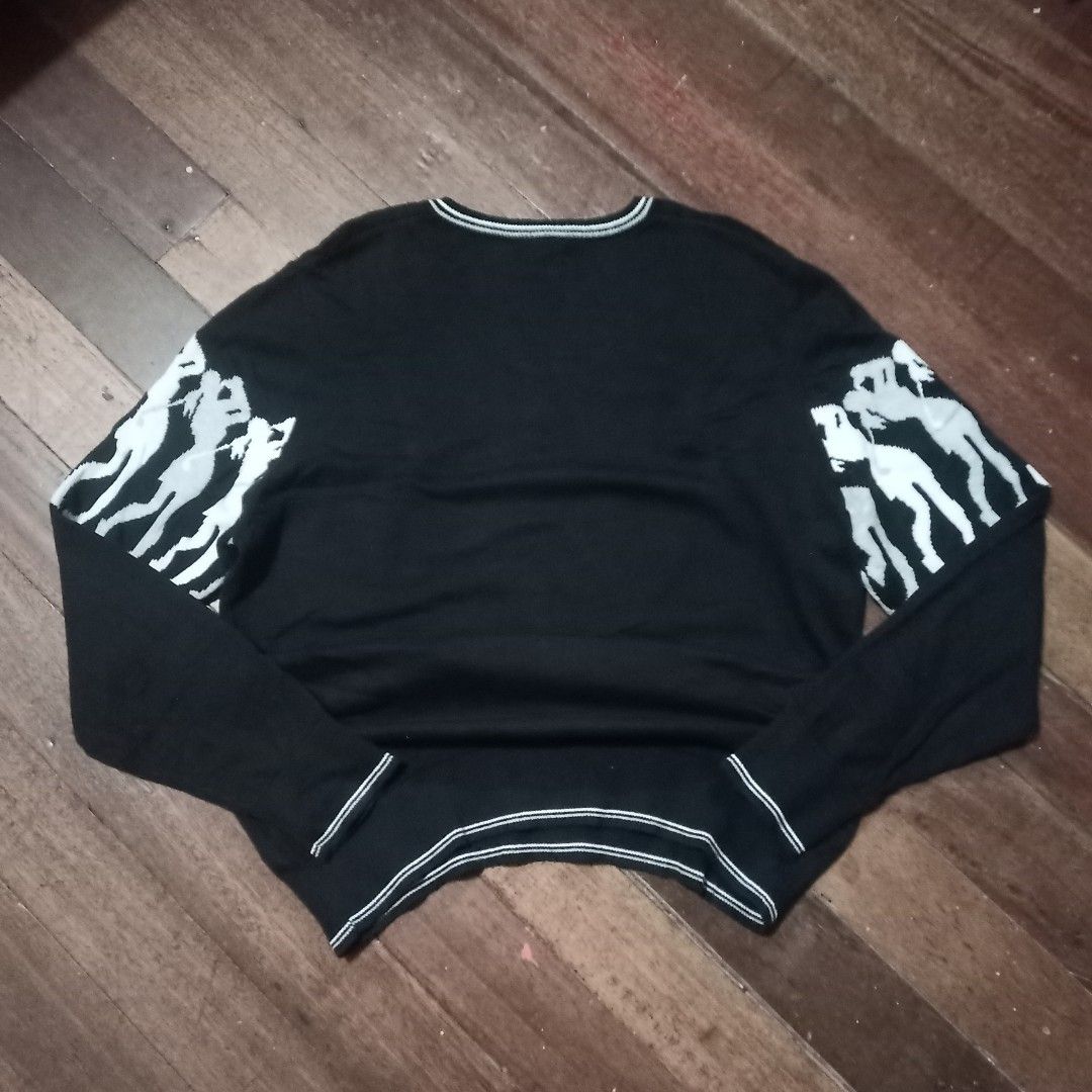 Black knitted sweater V shaped (Category: Coats, Jackets and Outerwear) located in Cavite. Submitted by kurtgg.what (Listing ID 1470799145, Image 3). Description: - Brand: Daily Sports - Item: Golf sweater - Color: Black with contrast tipping on V-neck - Design: Repeating golfer silhouettes graphic across chest and sleeves - Details: Ribbed cuffs and hem - Size: XXL - Condition: Excellent pre-loved condition (ready to wear).