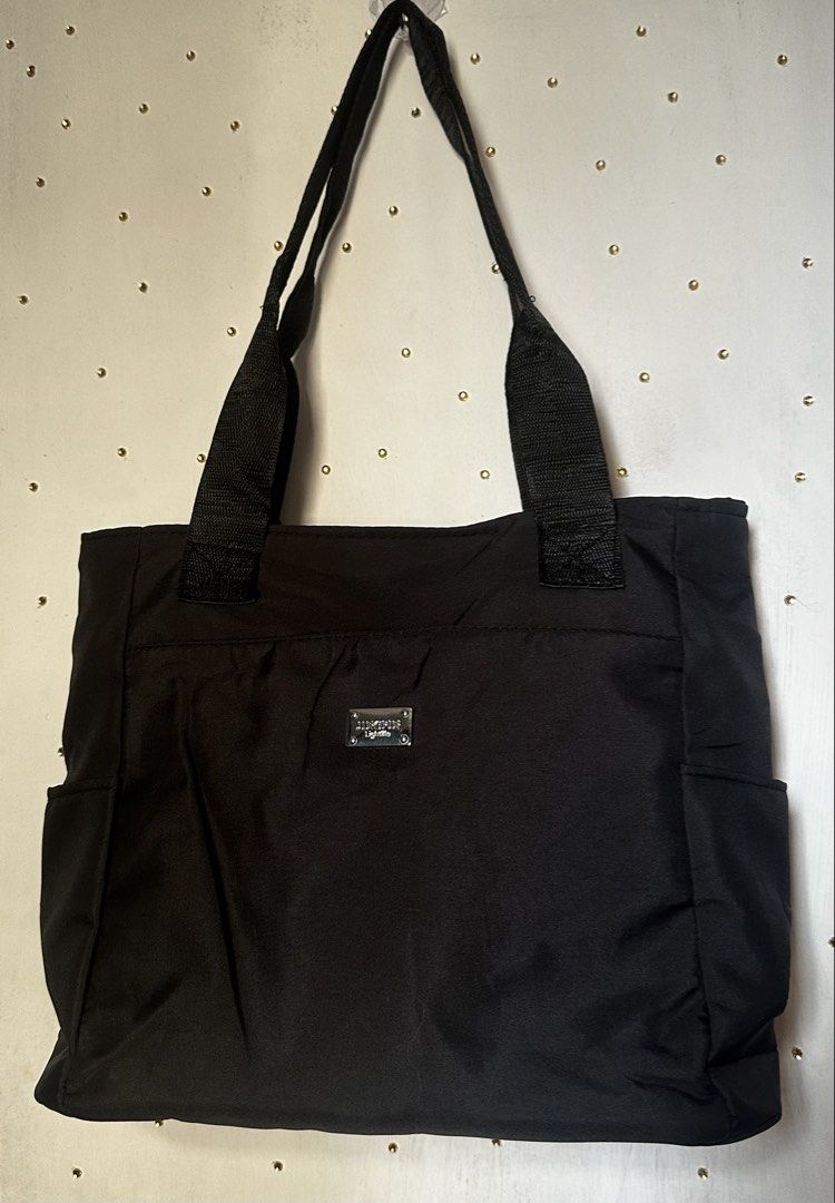 black nylon tote bag (Category: Tote Bags) located in Cavite. Submitted by chicfinds.slay (Listing ID 1470847646, Image 1). Description: ✨brandnew hindi nagamit nastock lang sa closet ✨ spacious very convenient a go to bag ✨last pic sample only .