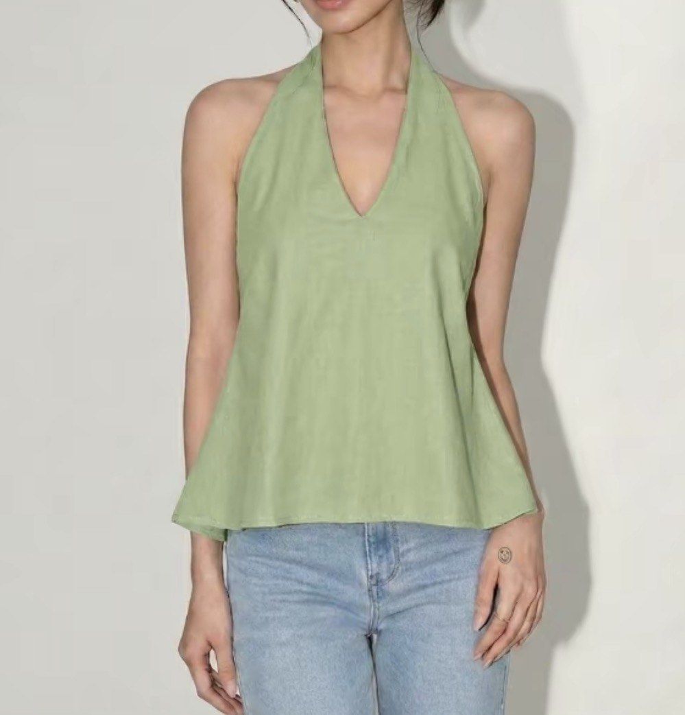 Black satin cami and green halter crop top bundle (Category: Sleeveless) located in Quezon City. Submitted by shrlane (Listing ID 1470889308, Image 3). Description: - Only fitted never worn outside - Top 1: Black satin cami style with delicate lace trim and spaghetti straps - Top 2: Sage green halter neck with an adjustable self-tie back strap - Lightweight fabrics, ideal for warm weather - Wardrobe clearout item, selling both together.