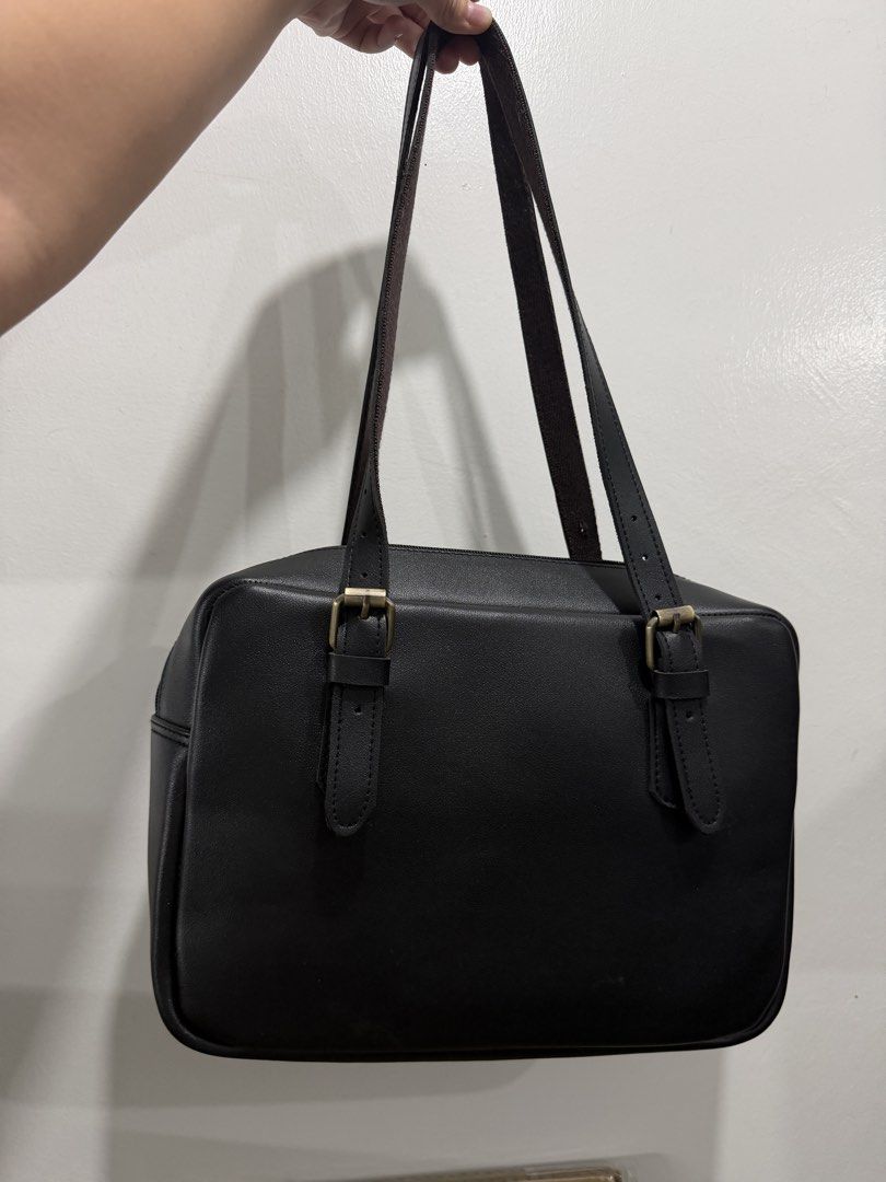Black Shoulder Bag (Category: Shoulder Bags) located in Pasig City. Submitted by rain_rain. (Listing ID 1470866355, Image 3). Description: FOR SALE: Marikina Made Shoulder Bag Adjustable - Style: Simple everyday black shoulder bag - Origin: Proudly handcrafted in Marikina - Dimensions: 8.5 x 13 inches with a spacious interior - Hardware: Brass-tone accents with a secure top zip closure - Straps: Conveniently adjustable - Quality: Made with durabl