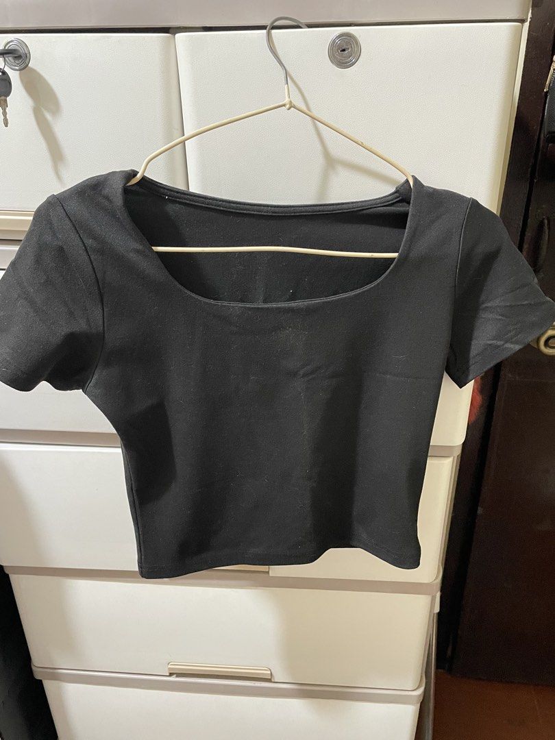 Black square neck crop top short sleeve (Category: Shirts) located in Manila. Submitted by ysadeclutters (Listing ID 1470805768, Image 1). Description: Decluttering [preloved] small - Color: Classic black - Style: Crop top with a wide square neckline and short sleeves - Fit: Standard fit, stretchy and comfortable material - Condition: Clean, no stains or damage - Versatility: Great basic tee for high-waisted jeans or skirts.