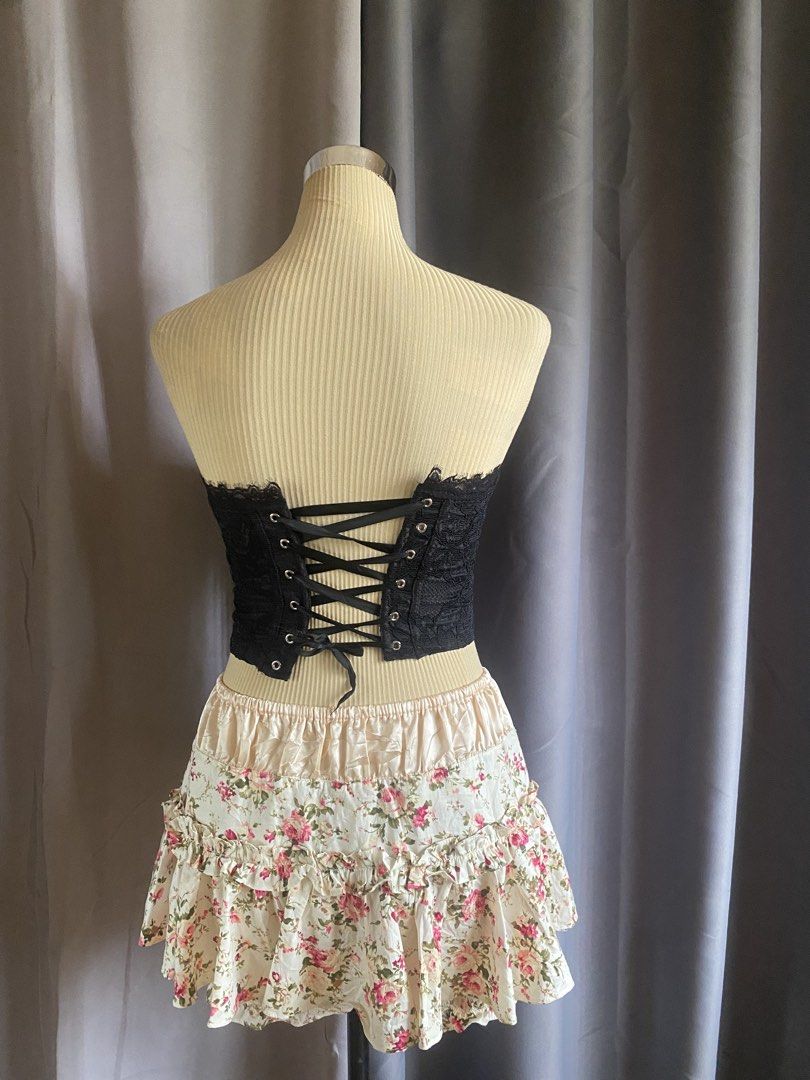 Black Strapless Lace-Up Corset Top (Category: Sleeveless) located in Cagayan de Oro. Submitted by curated_closetph (Listing ID 1470745302, Image 3). Description: — Size: XS - S — Color: Black — Floral lace overlay with structured vertical boning — Strapless neck with scalloped eyelash lace trim — Lace-up grommet ribbon back closure — Deep pointed asymmetrical hem — Fully lined front panels — Can negotiate the price — 🛒 Shop more to get more disc