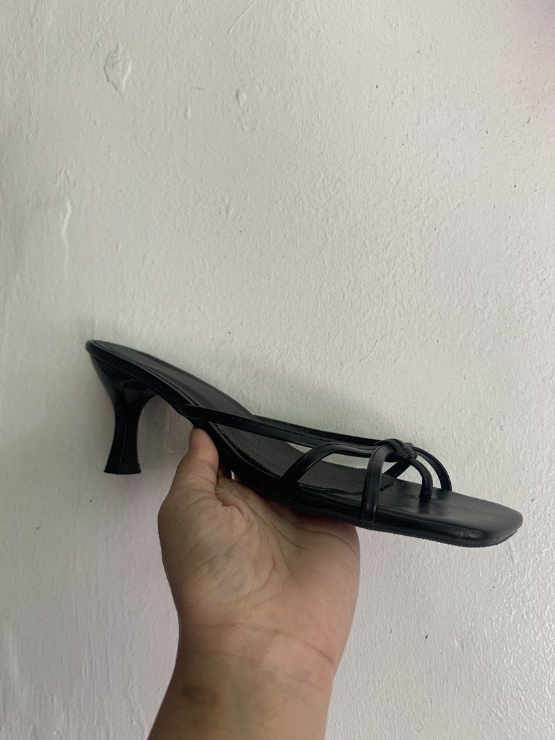Black Strappy Kitten Heels Square Toe (Category: Heels) located in Manila. Submitted by mixwearclosetclothingstore (Listing ID 1470762579, Image 2). Description: - Style: Black strappy heels with a modern square toe and elegant thin kitten heels - Detail: Delicate knotted straps across the top for a stylish look - Inclusions: Comes with the original teal ONEW shoe box - Condition: Brand new, sole shows only minor dust from handling - Sizing: Size