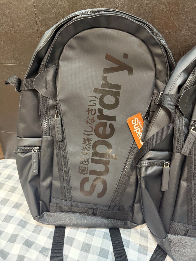 Black Superdry Backpack - Imported from Vietnam (Category: Backpacks) located in Makati City. Submitted by gigidvd (Listing ID 1470824167, Image 1). Description: - Brand new from Vietnam factories - Multiple zippered compartments and external pockets for easy organization - Interior organization slots for pens and small essentials - Comfortable padded mesh shoulder straps with adjustable chest strap.