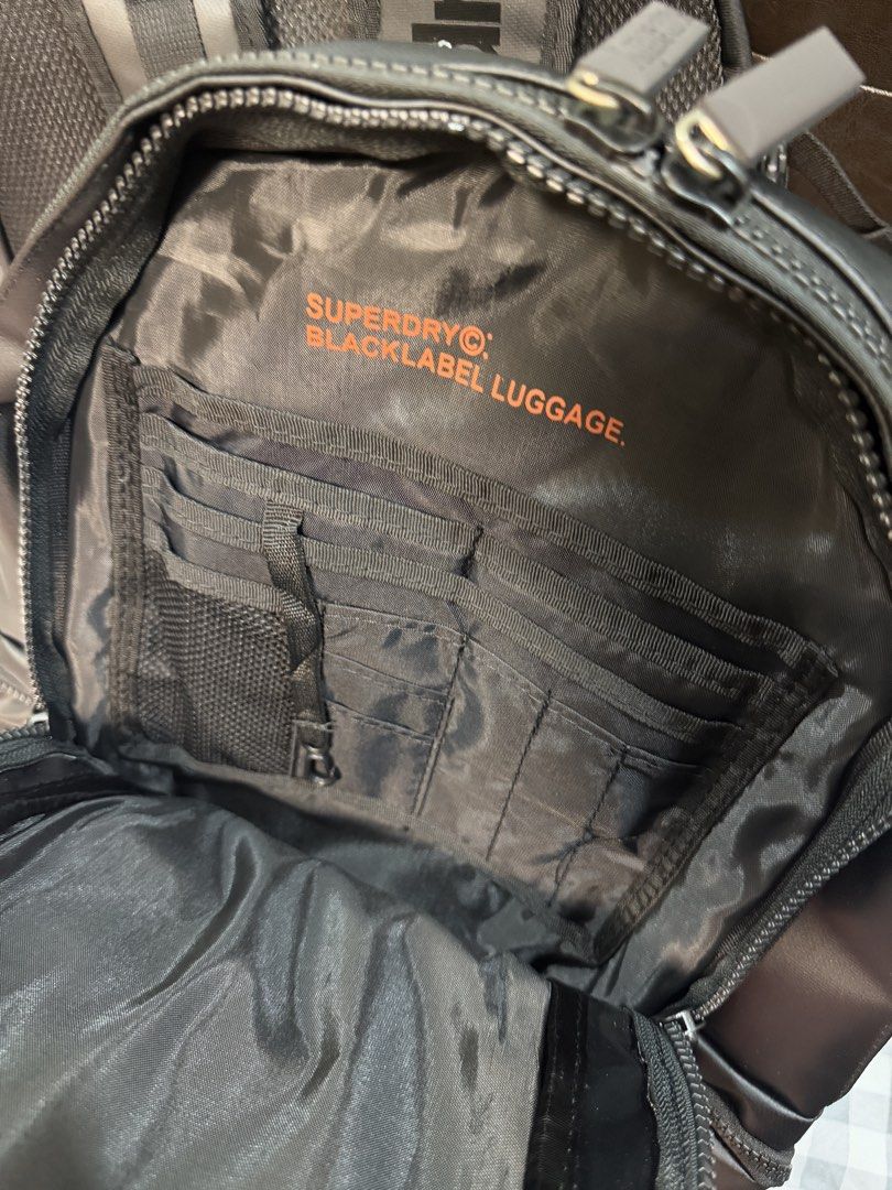 Black Superdry Backpack - Imported from Vietnam (Category: Backpacks) located in Makati City. Submitted by gigidvd (Listing ID 1470824167, Image 3). Description: - Brand new from Vietnam factories - Multiple zippered compartments and external pockets for easy organization - Interior organization slots for pens and small essentials - Comfortable padded mesh shoulder straps with adjustable chest strap.