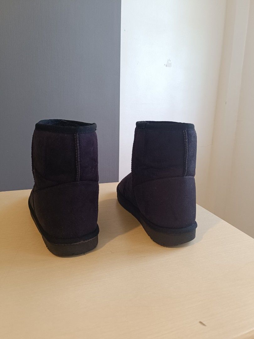 Black winter boots short ankle style (Category: Boots) located in Makati City. Submitted by xandra31 (Listing ID 1470899714, Image 2). Description: Black short ankle boots with soft inner lining. Slip-on design. Flat rubber soles. Simple winter footwear staple. Minimal wear visible on the outer suede-like material. size 24 cm.