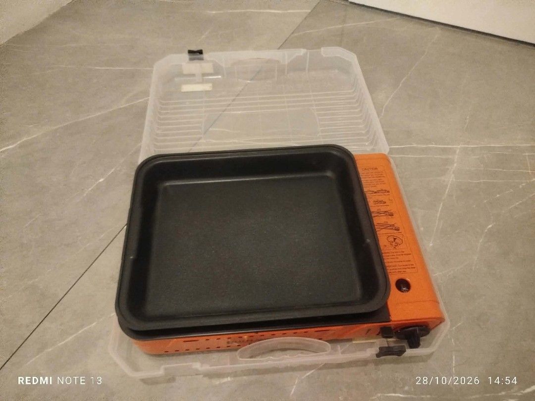 Blu Flame Portable Gas Stove Deep Grill (Category: BBQ, Grills & Hotpots) located in Taguig. Submitted by manilyn_lau (Listing ID 1470907729, Image 3). Description: - Brand: Blu Flame portable gas stove - Color: Vibrant orange - Inclusions: Comes with a deep grill pan and original hard plastic storage case - Condition: Brand new, never used, with original protective bubble wrap intact - Perfect for: Indoor cooking, samgyupsal at home, camping, an