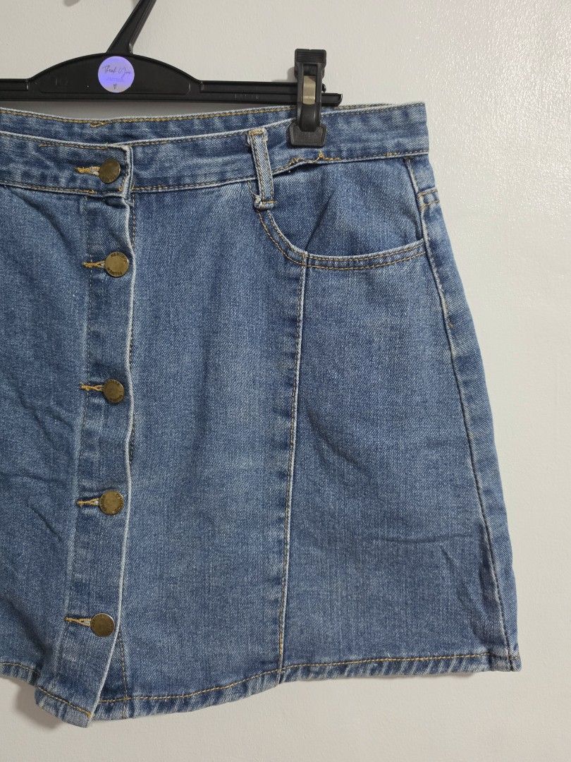 Blue Denim Skirt with Inner Shorts Button Front skort (Category: Skirts) located in Paranaque City. Submitted by franinnashop (Listing ID 1470840566, Image 2). Description: Declutter - Color & Style: Blue denim skirt with front button closure and contrast stitching - Comfort & Coverage: Includes built-in inner shorts underneath for extra peace of mind - Features: Functional front and back pockets, plus belt loops - Measurements: Waist 34 inches, 
