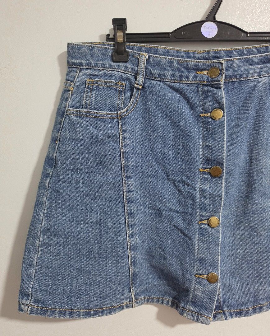 Blue Denim Skirt with Inner Shorts Button Front skort (Category: Skirts) located in Paranaque City. Submitted by franinnashop (Listing ID 1470840566, Image 3). Description: Declutter - Color & Style: Blue denim skirt with front button closure and contrast stitching - Comfort & Coverage: Includes built-in inner shorts underneath for extra peace of mind - Features: Functional front and back pockets, plus belt loops - Measurements: Waist 34 inches, 