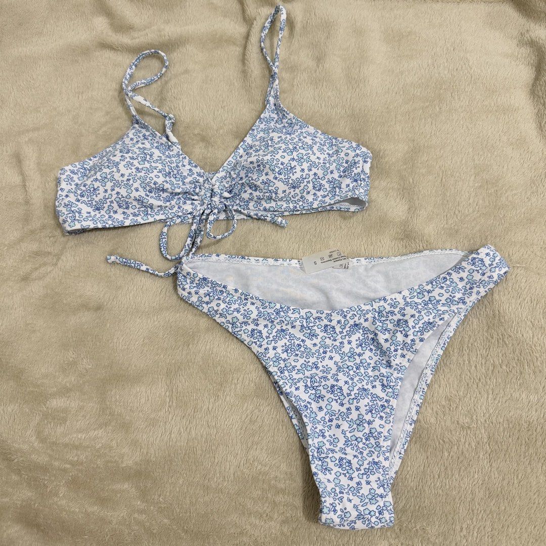 Blue Floral Two-Piece Bikini Set Size S (Category: Bikinis & Swimsuits) located in Manila. Submitted by kbm._. (Listing ID 1470929744, Image 1). Description: - Style: Blue and white floral print two-piece bikini - Condition: Brand new with tags (BNWT), never worn - Size: Small - Features: Adjustable straps, playful front tie detail, and trendy high-cut leg bottoms - Fabric: Soft and stretchy material for a comfortable fit - Mode of transaction: S