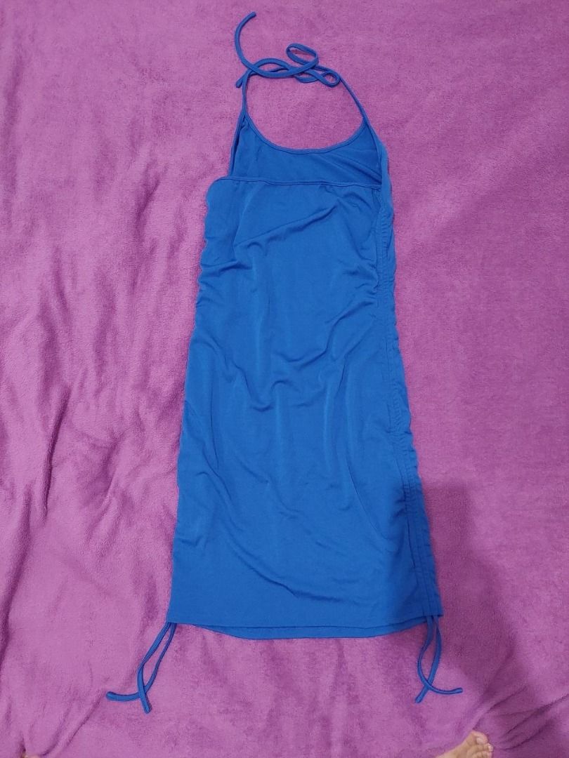 Blue Halter Mini Dress (Category: Dresses) located in Bulacan. Submitted by nicschill18300 (Listing ID 1470866428, Image 3). Description: Brand: SHEIN CURVE Size: 1XL Color: Bright blue / royal blue Style: Sleeveless halter-neck dress Length: Mini dress Design: Slim, body-hugging silhouette Details: Tie-up halter neckline and adjustable-looking side drawstrings near the hem.