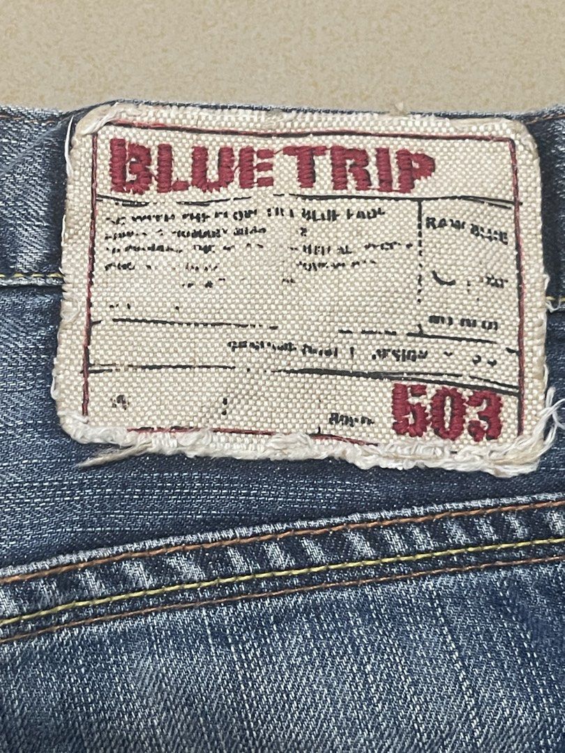 Blue Trip 503 Denim Jeans (Category: Jeans) located in Davao. Submitted by rcgulanes.moon (Listing ID 1470880916, Image 1). Description: - Brand/Model: Blue Trip 503 denim jeans - Design: Whiskering effects on front and back legs - Pockets: Flap back pockets with red stitching and button closure - Details: Classic canvas patch on back waistband and distressed hem edges - Material: Sturdy denim fabric throughout.