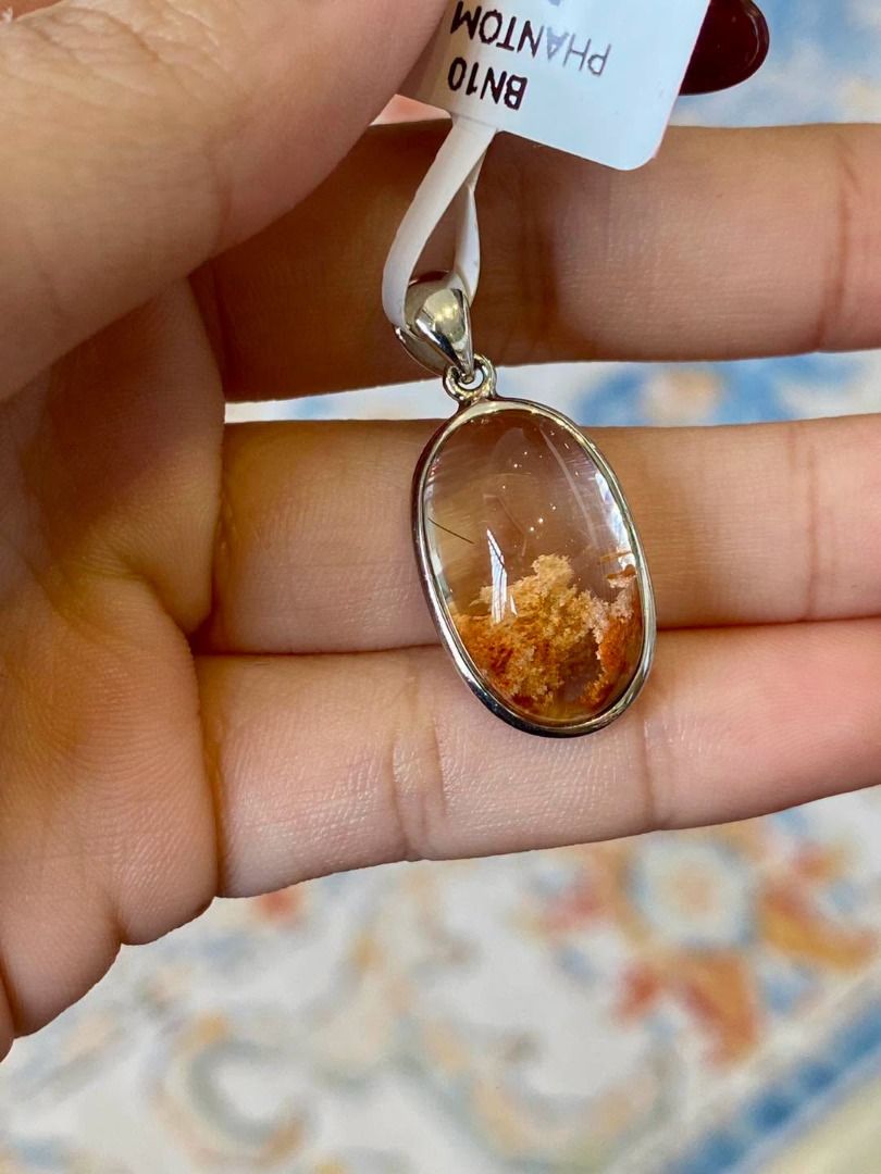BNEW PHANTOM QUARTZ SILVER PENDANT (Category: Body Jewelry) located in Baguio. Submitted by asna_taku (Listing ID 1470818359, Image 1). Description: 🤎✨ BNEW PHANTOM QUARTZ SILVER PENDANT ✨💎 A breathtaking piece of nature’s artistry! 🍂 Featuring a beautiful, transparent oval-shaped Phantom Quartz with mesmerizing earthy golden-brown inclusions that resemble a miniature landscape captured inside the crystal. 🌿 Elegantly set in polished silver, 