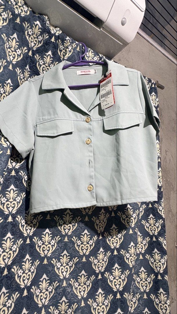 Bobson Light Green Boxy Blouse Size S (Category: Blouses) located in Munoz. Submitted by joanadelara (Listing ID 1470836898, Image 3). Description: - Original price: 699 - Condition: Brand new with original retail tags attached - Size: Small - Color: Light green - Material: Special textured fabric - Fit: Trendy boxy fit with short sleeves .
