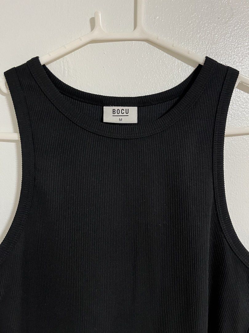 BOCU Black Ribbed Crop Tank Top (Category: Sleeveless) located in Cabuyao City. Submitted by rdtrmt (Listing ID 1470743859, Image 2). Description: - Brand: BOCU - Color: Classic black - Size: Medium - Material: Comfortable ribbed knit - Design: Thick straps and scoop neckline - Fit: Crop top style - Style: Versatile basic piece that goes with everything - Condition: still in good condition.