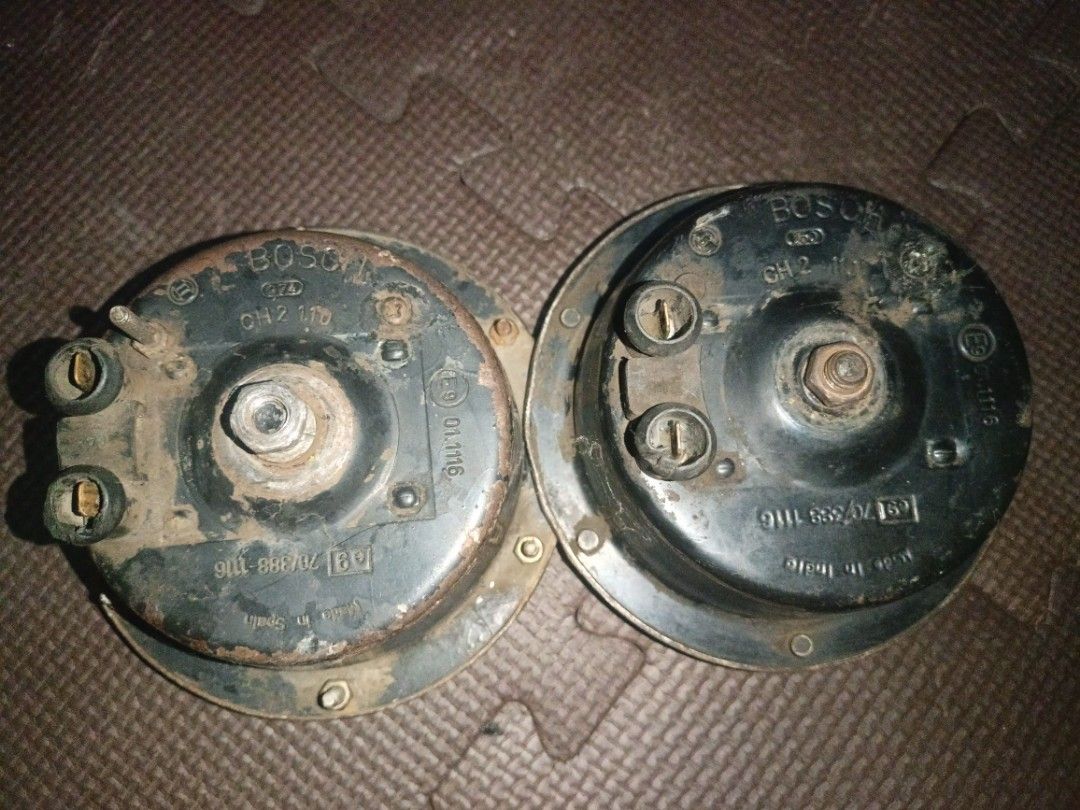 Bosch CH 2 110 Car Horns Pair (Category: Soundbars, Speakers & Amplifiers) located in General Trias. Submitted by jonvicjosu23851 (Listing ID 1470858786, Image 2). Description: - Genuine pair of Bosch CH 2 110 car horns - Origins: One unit made in Spain, one made in India - Features standard dual terminal connections on the back - Complete with original mounting hardware and adjustment bolts - Condition: Heavy patina, visible rust, wear, and dust