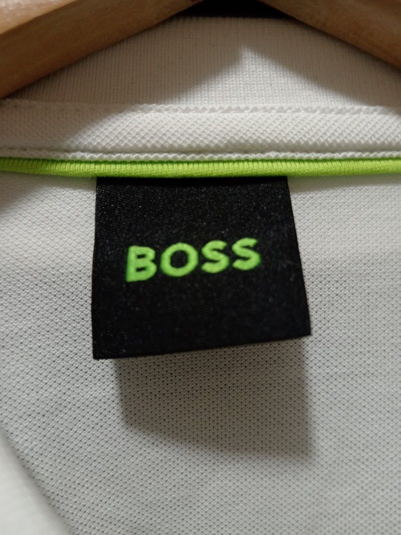 BOSS White Polo Shirt Size XL (Category: Tshirts & Polo Shirts ) located in Baguio. Submitted by solo_ukay (Listing ID 1470807577, Image 2). Description: - Brand: BOSS - Color: Clean White - Size: XL - Material: 95% Cotton, 5% Spandex for comfortable stretch - Design: Short sleeves, classic collar with button placket, subtle embroidered logo on the chest - Condition: Great casual staple.