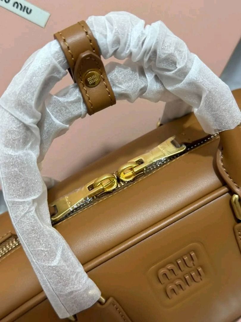 Bowling bag‼️ (Category: Shoulder Bags) located in Manila. Submitted by bagsallshop (Listing ID 1470833396, Image 1). Description: ✅ Style: Tan Leather Bowling Bag ✅ Condition: Brand new with protective plastic on handles and metal feet ✅ Hardware: Gold-tone ✅ Interior: Fabric-lined with a secure zip pocket ✅ Inclusions: dust bag, paperbag .