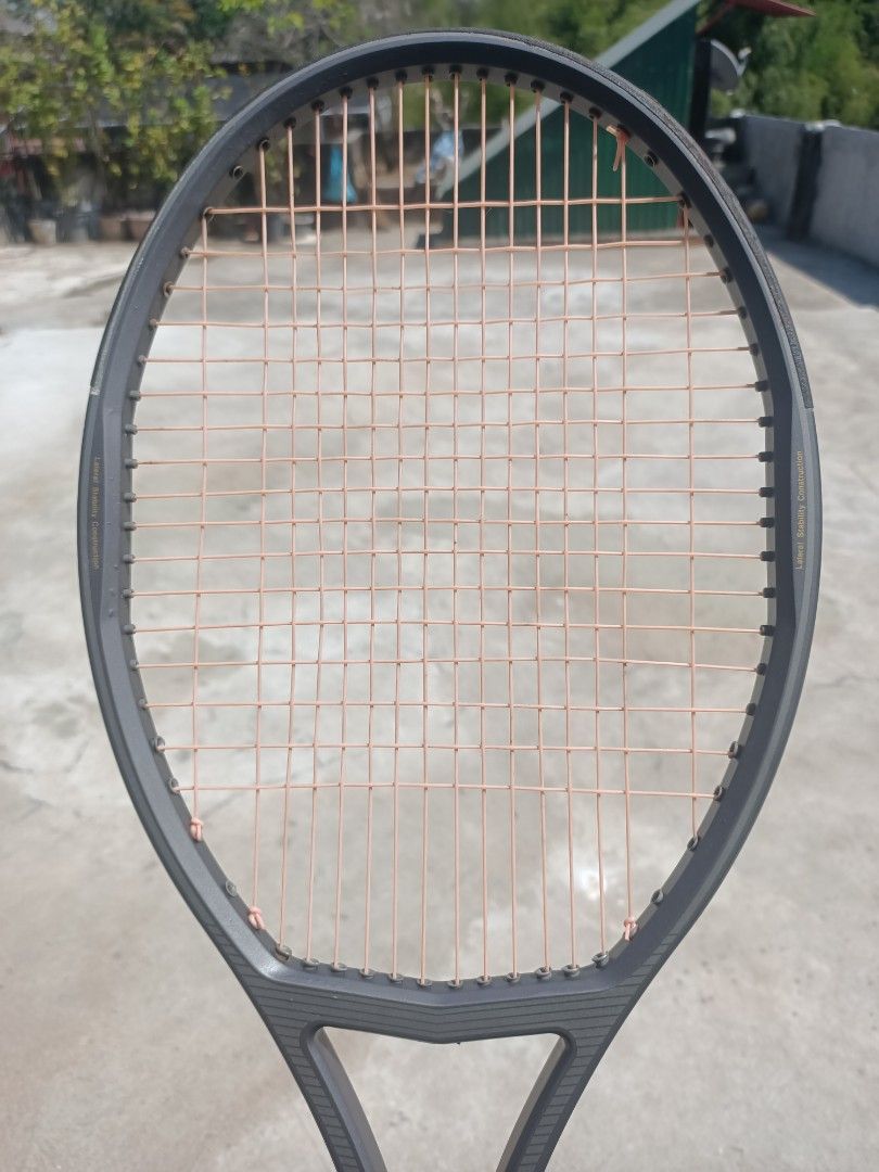 Branded Tennis Rackets (Category: Racket and Ball Sports) located in Taguig. Submitted by grandfish_55ab5c (Listing ID 1470770589, Image 2). Description: - Brand/Model: Wimbledon Rosa tennis racket - Color/Strings: Dark grey frame with white strings - Technology: Sweet spot anti-vibration tech on the sides - Condition: Strung, ready to play, normal scuffs from recreational play - Specs: Standard grip size - Ideal for: Casual matches and weekend p