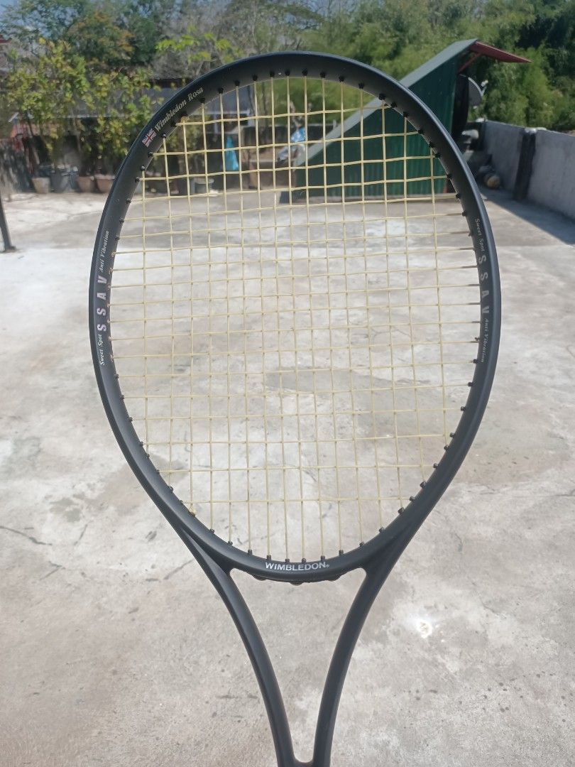 Branded Tennis Rackets (Category: Racket and Ball Sports) located in Taguig. Submitted by grandfish_55ab5c (Listing ID 1470770589, Image 1). Description: - Brand/Model: Wimbledon Rosa tennis racket - Color/Strings: Dark grey frame with white strings - Technology: Sweet spot anti-vibration tech on the sides - Condition: Strung, ready to play, normal scuffs from recreational play - Specs: Standard grip size - Ideal for: Casual matches and weekend p