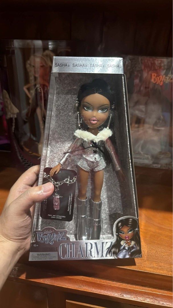 BRATZ CHARMZ SET (Category: Kids Toys) located in Quezon City. Submitted by deporky (Listing ID 1470838518, Image 3). Description: - Complete Bratz Charmz collection including Cloe, Sasha, and Yasmin dolls - Dressed in stylish shiny silver outfits and matching silver boots - Comes brand new in original clear-window packaging - Includes exclusive collectible charm chains for each doll: - Cloe: Blonde hair with star charm - Sasha: Dark hair with ph