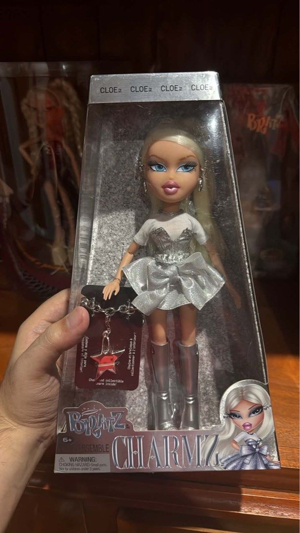 BRATZ CHARMZ SET (Category: Kids Toys) located in Quezon City. Submitted by deporky (Listing ID 1470838518, Image 2). Description: - Complete Bratz Charmz collection including Cloe, Sasha, and Yasmin dolls - Dressed in stylish shiny silver outfits and matching silver boots - Comes brand new in original clear-window packaging - Includes exclusive collectible charm chains for each doll: - Cloe: Blonde hair with star charm - Sasha: Dark hair with ph