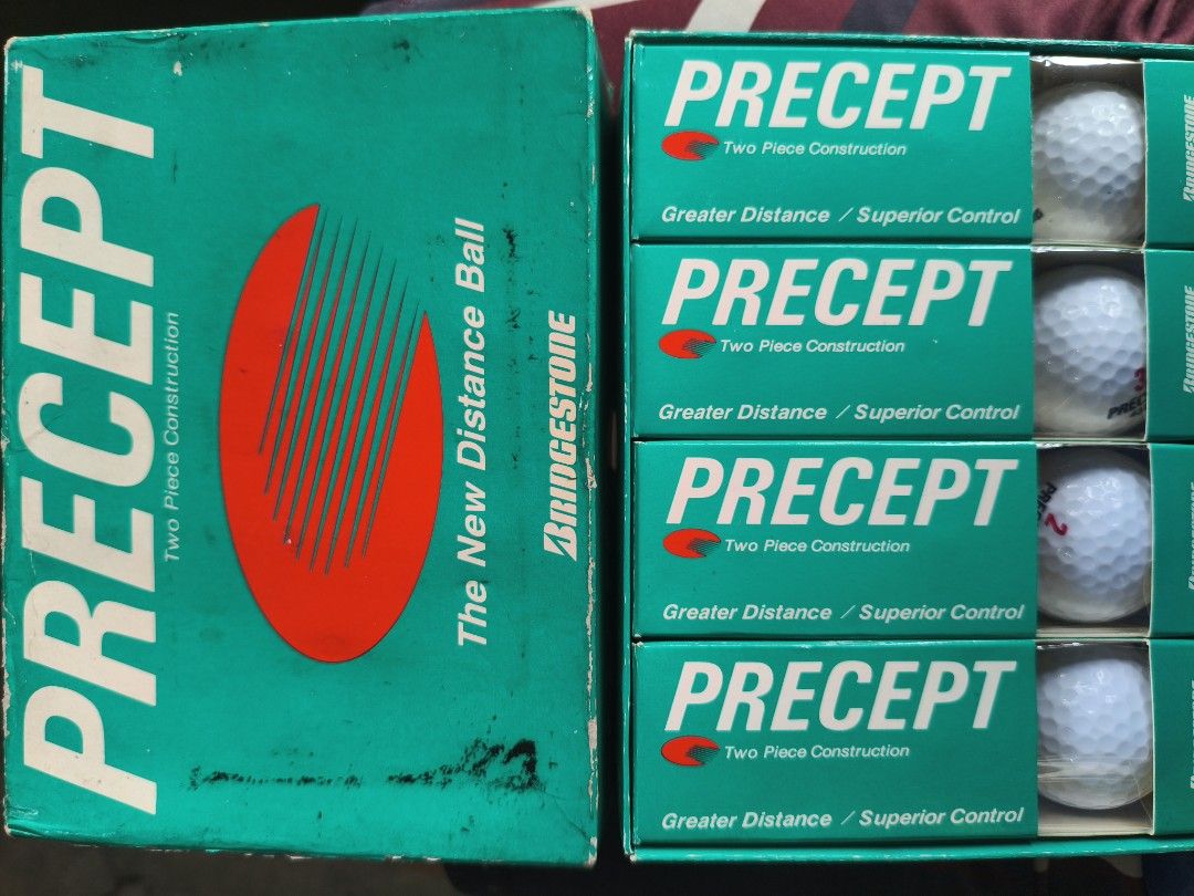 Bridgestone Precept Two Piece Construction Distance Golf Balls Box (Category: Golf) located in Manila. Submitted by tonio124 (Listing ID 1470797817, Image 2). Description: - Item: Vintage Bridgestone Precept Golf Balls - Packaging: Original green box included (shows some storage wear and scuffing) - Condition: Inner sleeves and golf balls are brand new/unused - Performance: Two-piece construction designed for maximum distance and superior control