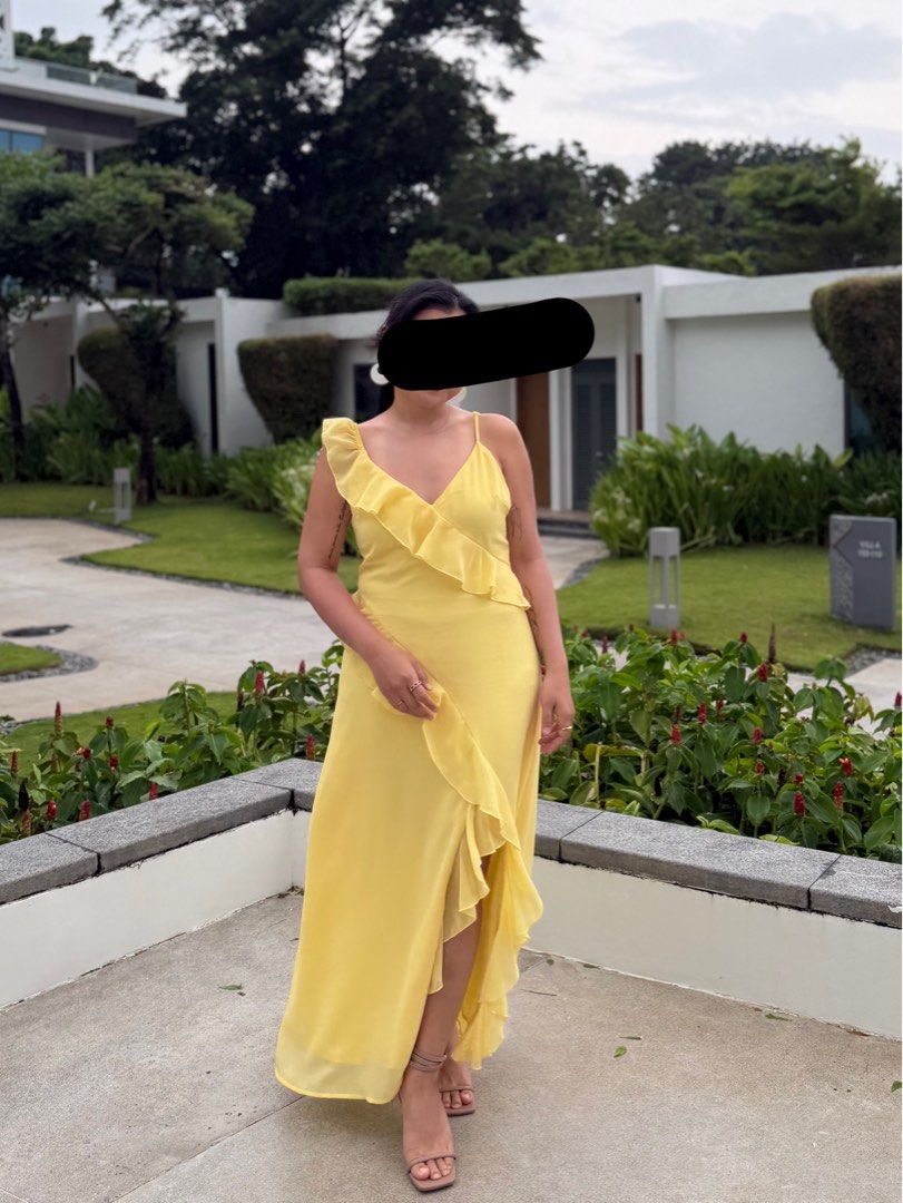 Bright Yellow Ruffled Maxi Dress (Category: Dresses) located in Manila. Submitted by riajoyach23939 (Listing ID 1470861412, Image 3). Description: - Color: Bright yellow - Style: Maxi dress with V-neck, ruffled detailing, and high-low hem - Features: Spaghetti straps, lightweight and flowing fabric - Perfect for: Beach trips, vacations, and sunny outdoor events - Condition: Worn once for a wedding, clean and well-kept.