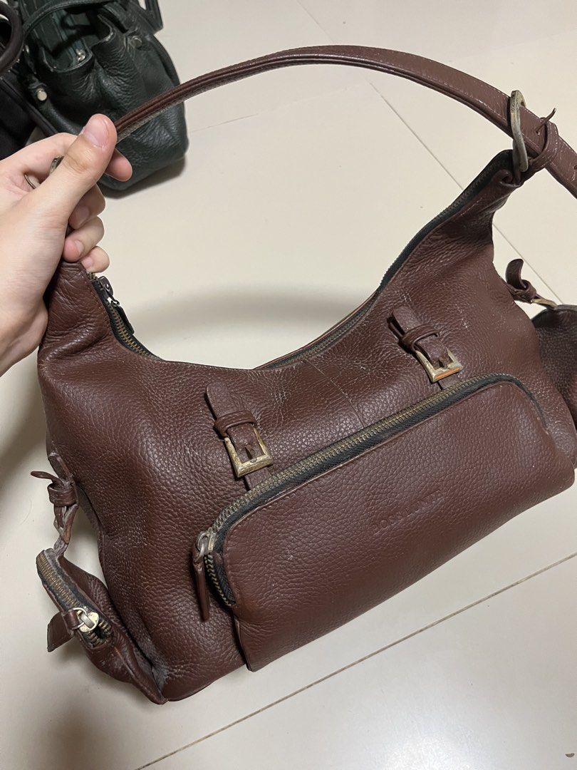 Brown authentic leather shoulder bag with zipper pockets (Category: Luxury Bags & Wallets) located in General Trias. Submitted by walterwhiteyo (Listing ID 1470760972, Image 2). Description: see photos for condition pls! yung mga white marks sa bag ay dusts langgg.