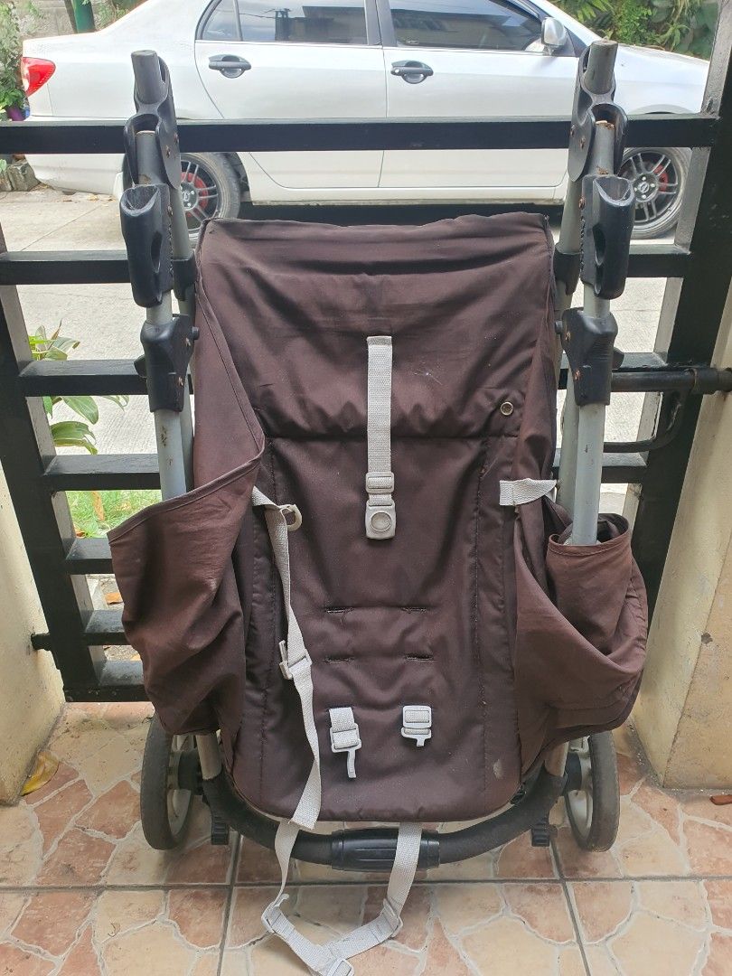 Brown Baby Stroller with Multi-Wheel Base (Category: Strollers) located in Paranaque City. Submitted by nicessities (Listing ID 1470750203, Image 2). Description: - Color:dark Brown with grey straps and a sturdy black frame - Comfort: Handlebar covered in soft black foam for a comfortable grip - Mobility: Multiple wheels designed for smooth rolling - Storage: Folds down compactly for easy transport and storage - Condition: Fabric shows some gener