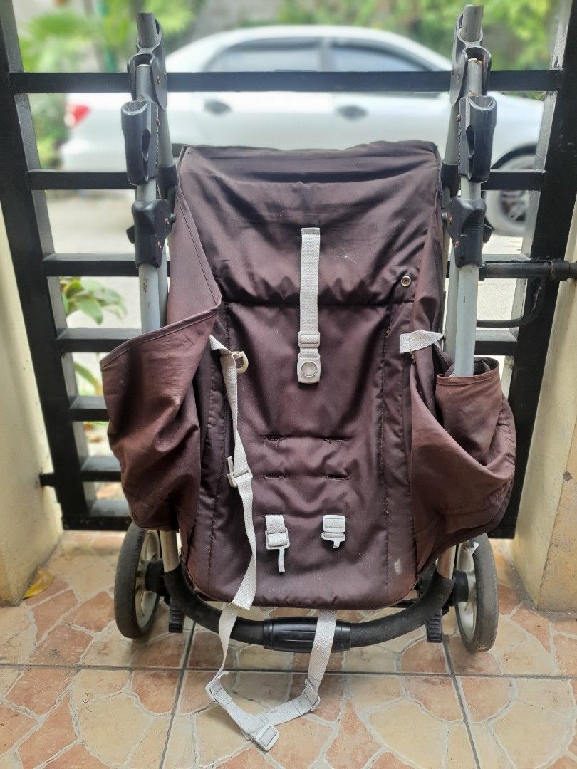 Brown Baby Stroller with Multi-Wheel Base (Category: Strollers) located in Paranaque City. Submitted by nicessities (Listing ID 1470750203, Image 3). Description: - Color:dark Brown with grey straps and a sturdy black frame - Comfort: Handlebar covered in soft black foam for a comfortable grip - Mobility: Multiple wheels designed for smooth rolling - Storage: Folds down compactly for easy transport and storage - Condition: Fabric shows some gener