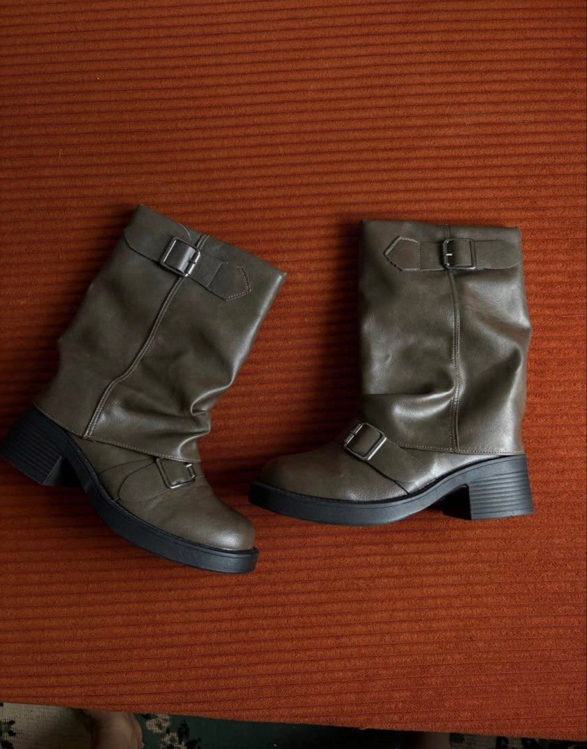 Brown Boots (Category: Boots) located in Manila. Submitted by jcb_1219 (Listing ID 1470779762, Image 1). Description: - Color: Dark green - Material: Soft faux leather - Length: Mid-calf with a stylish slouchy shaft - Details: Two adjustable buckle straps (top and ankle) - Sole & Heel: Durable lug sole with a chunky block heel - Toe: Round toe shape - Fit: Easy slip-on style.